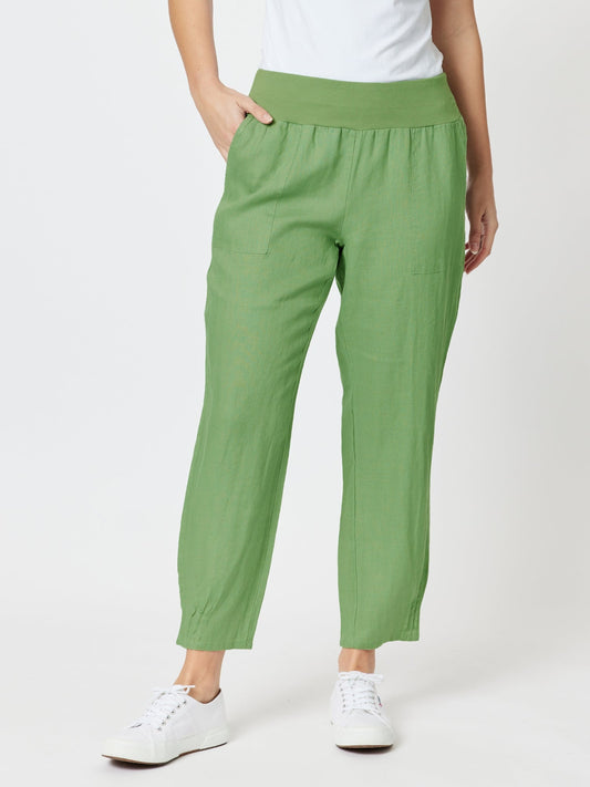 Image of a model wearing Pants. Product name - Sarah Linen Pleat Hem Pant Fern in Fern colour by brand - Gordon Smith
