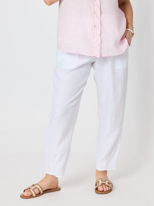 Image of a model wearing Pants. Product name - Sarah Linen Pleat Hem Pant White in White colour by brand - Gordon Smith