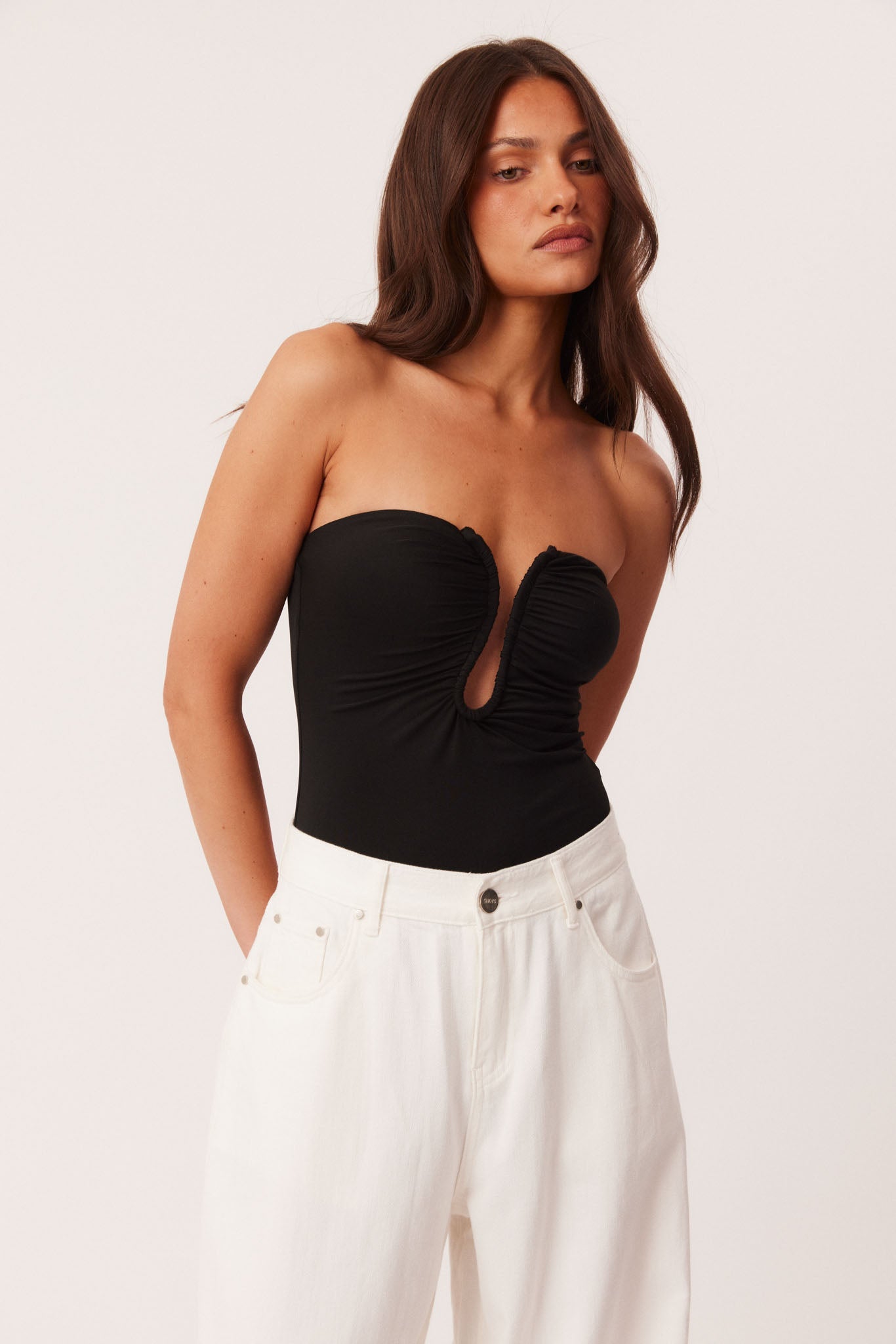 Image of a model wearing Tops. Productname: SNDYS LILANA BODYSUIT in Black colour by brand - SNDYS