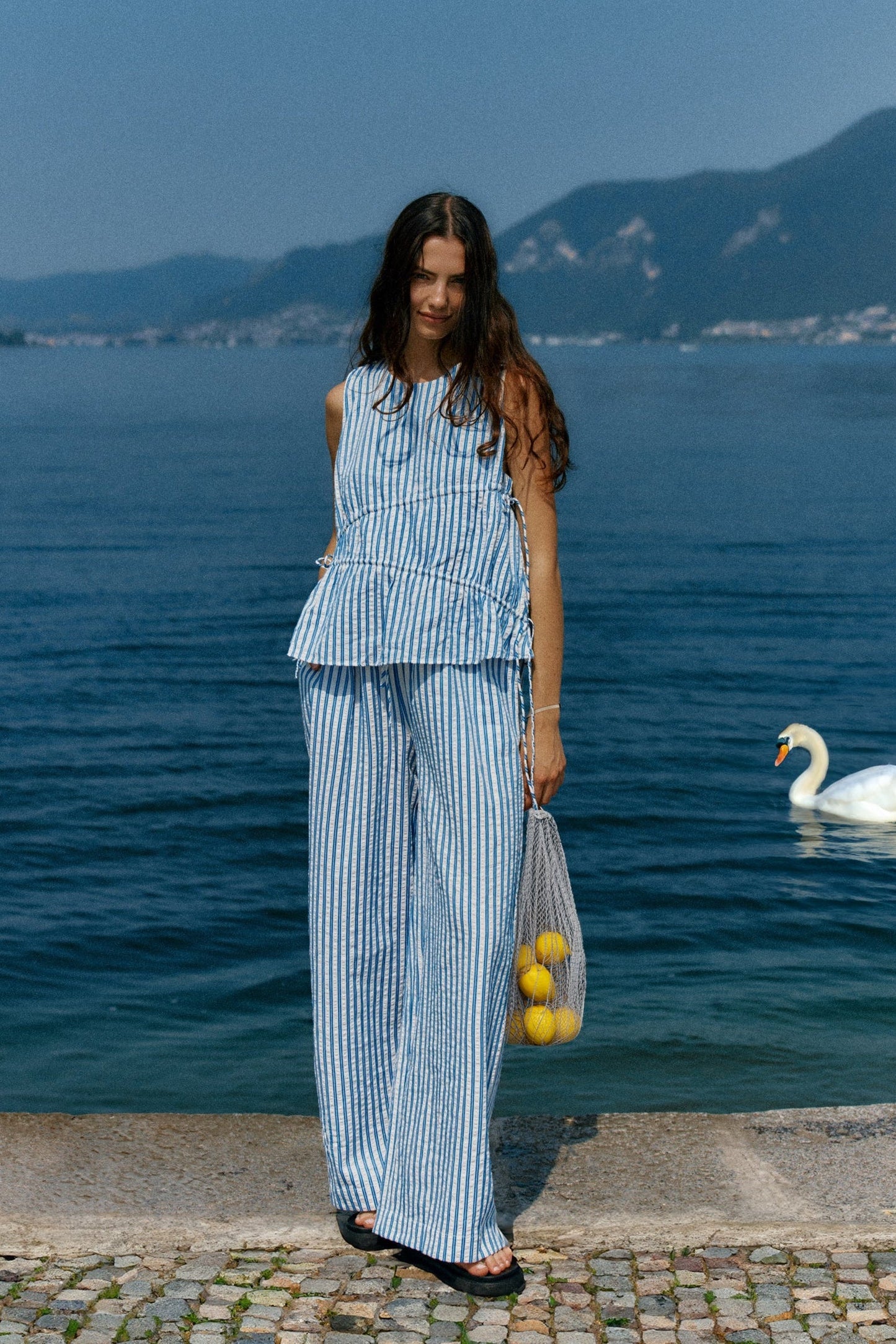 Image of a model wearing Pants. Product name - Aziza Pant Blue/White Stripe in Blue/ White Stripe colour by brand - Sass Clothing
