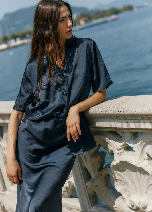 Image of a model wearing Tops. Product name - Jasper Satin Shirt Navy in Navy colour by brand - Sass Clothing