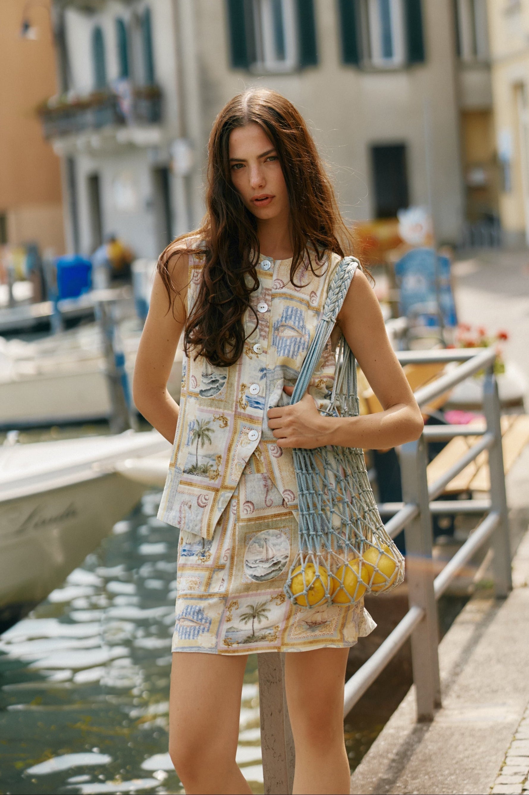 Image of a model wearing Skirts. Product name - Reo Mini Skirt Wayfarer Print in Wayfarer Print colour by brand - Sass Clothing