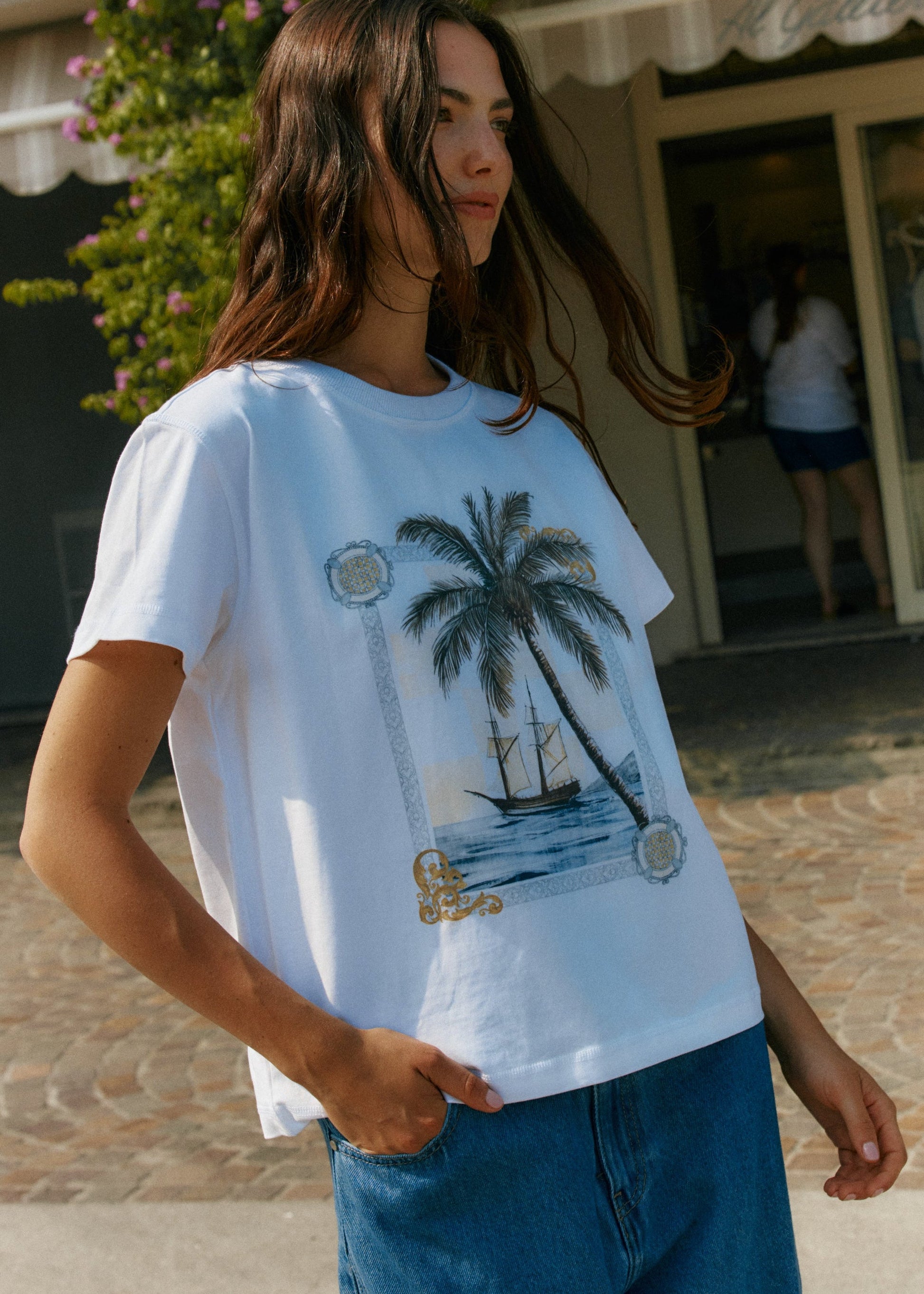 Image of a model wearing Tops. Product name - Ray Tee Sea Palm in Sea Palm colour by brand - Sass Clothing