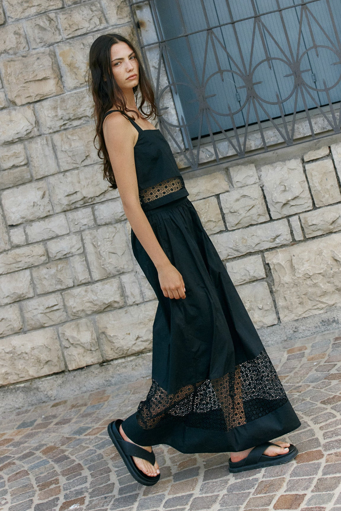 Image of a model wearing Skirts. Product name - Nixie Lace Skirt Black in Black colour by brand - Sass Clothing