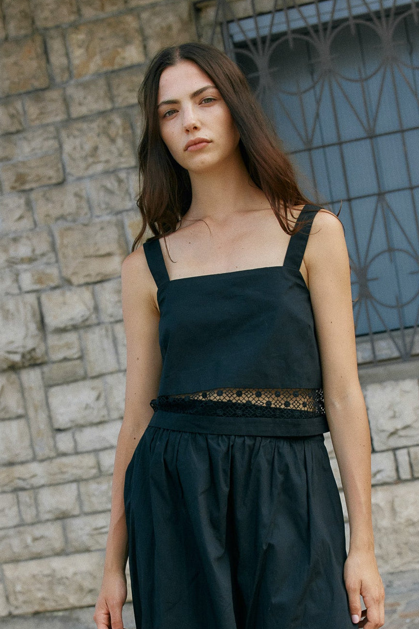 Image of a model wearing Tops. Product name - Nixie Lace Crop Black in Black colour by brand - Sass Clothing