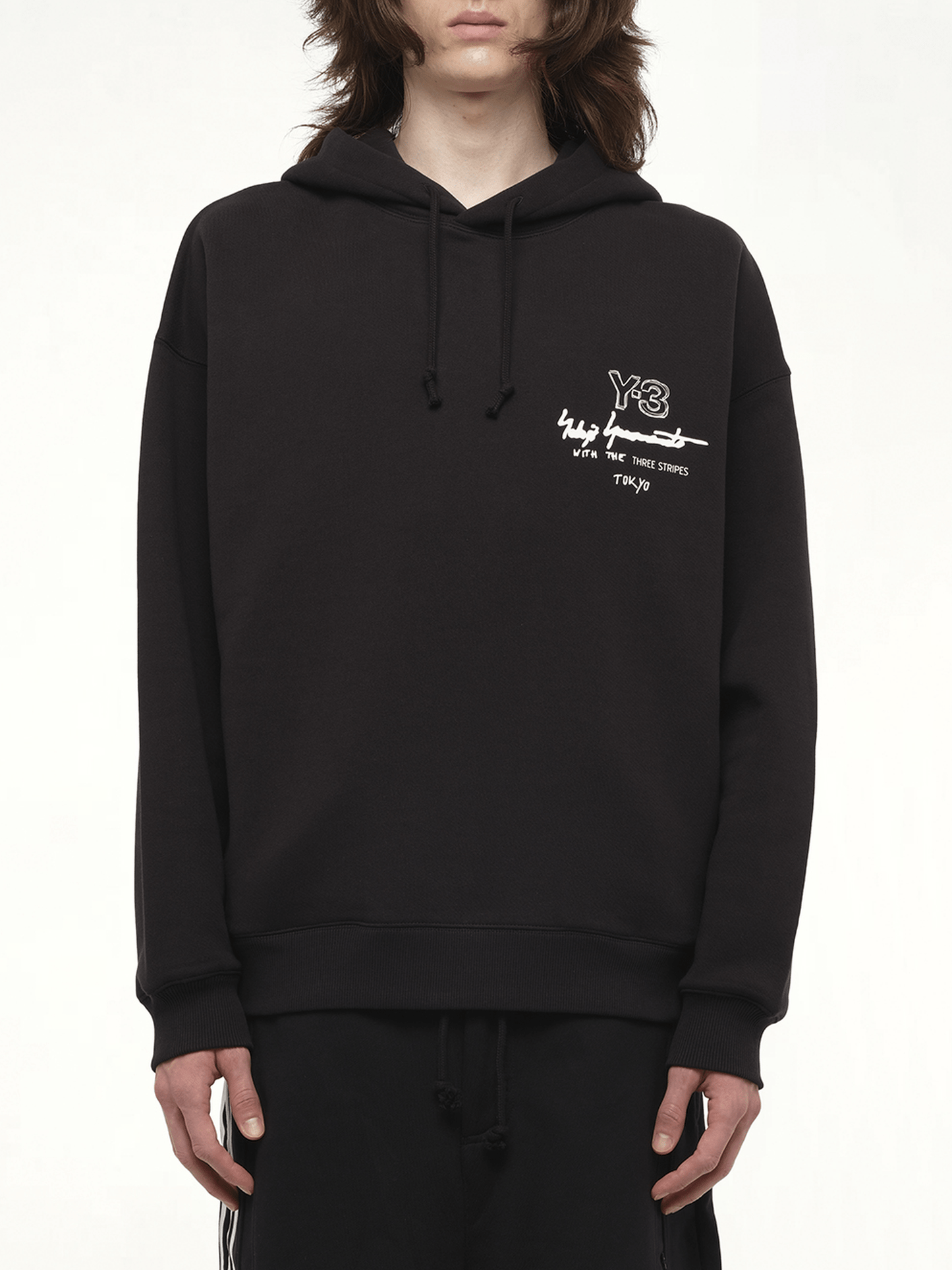 Image of a model wearing Outerwear. Productname: Y-3 Graphic Ft Hoodie in Black colour by brand - Y-3