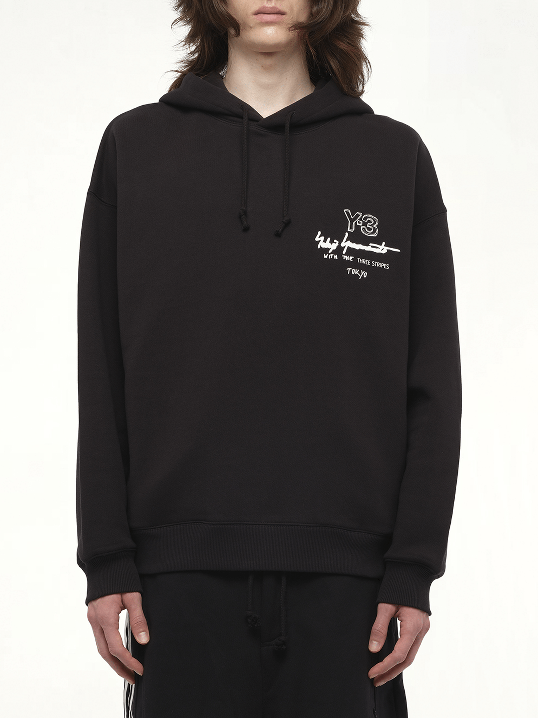 Image of a model wearing Outerwear. Productname: Y-3 Graphic Ft Hoodie in Black colour by brand - Y-3