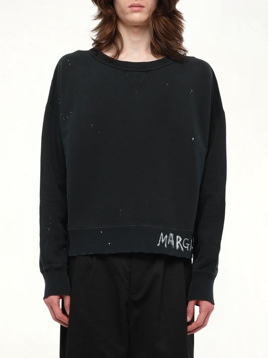Image of a model wearing Outerwear. Product name - Margiela Sweatshirt in Black colour by brand - MAISON MARGIELA