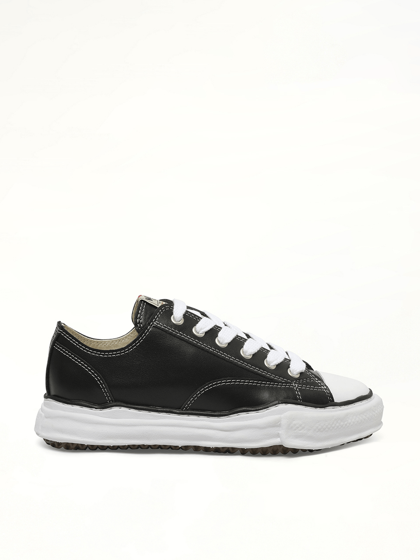 Image of Sneakers. Product name - Peterson OG Leather Low Sneaker in Black colour by brand - MAISON MIHARA YASUHIRO