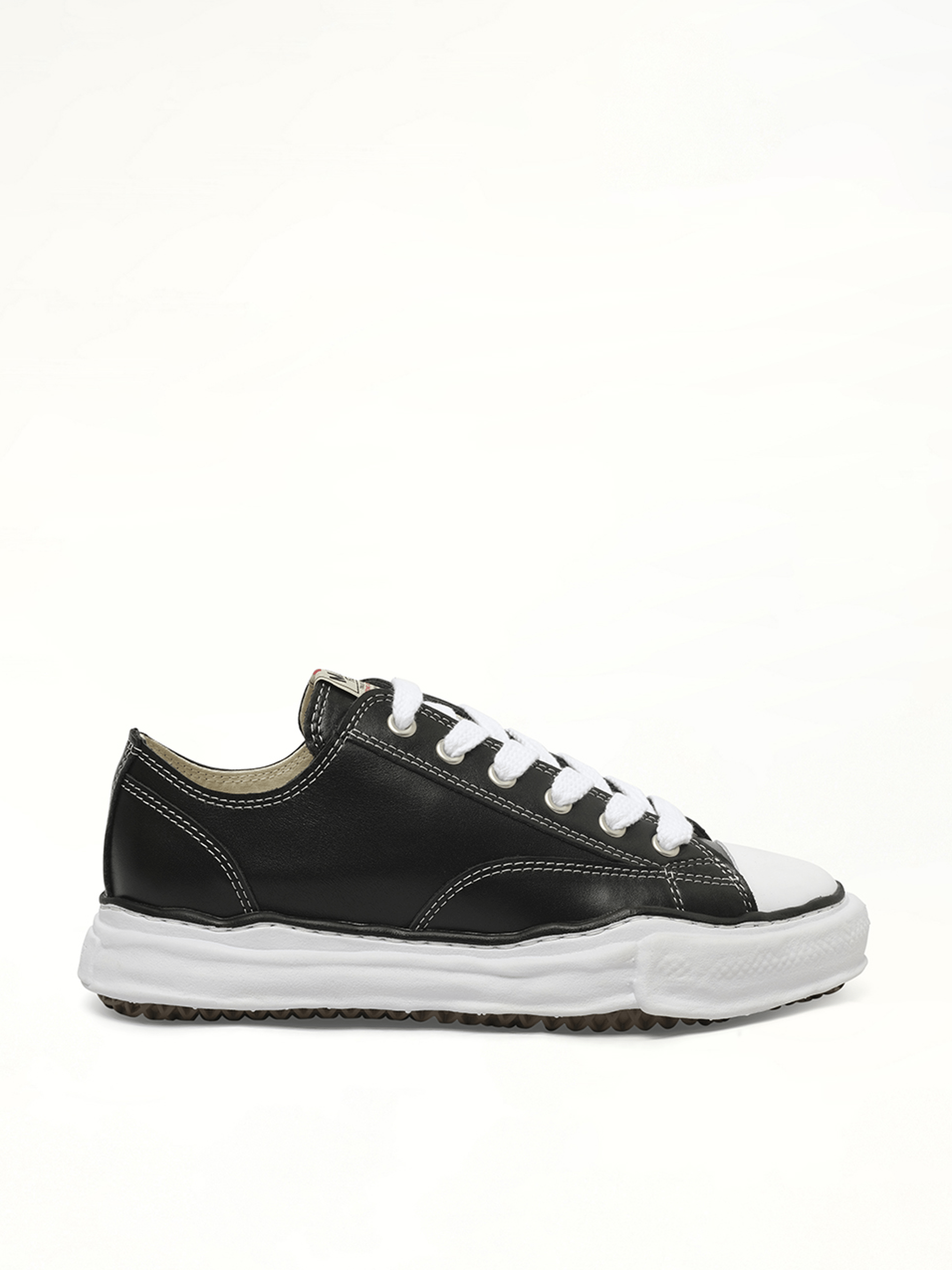 Image of Sneakers. Product name - Peterson OG Leather Low Sneaker in Black colour by brand - MAISON MIHARA YASUHIRO