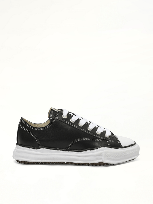 Image of Sneakers. Product name - Peterson OG Leather Low Sneaker in Black colour by brand - MAISON MIHARA YASUHIRO