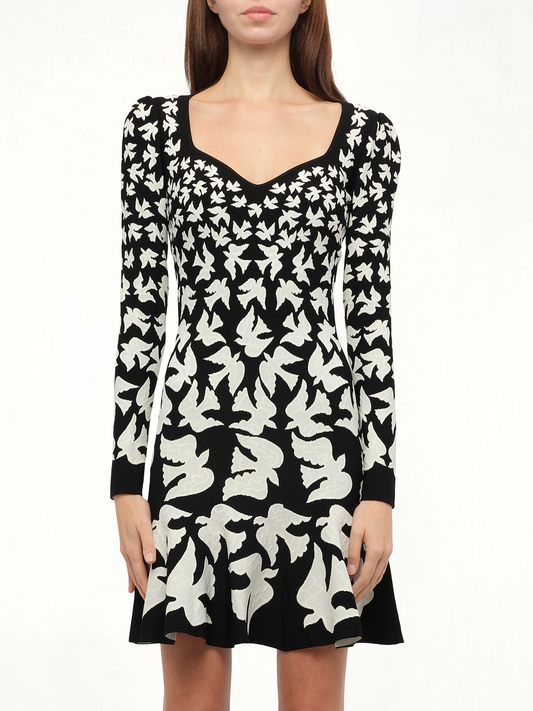 Image of a model wearing Dress. Productname: ALEXANDER MCQUEEN Knit Dress Birds in Black White colour by brand - ALEXANDER MCQUEEN