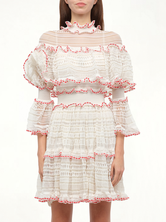 Image of a model wearing Dress. Productname: ALEXANDER MCQUEEN AMQ - Volume Lace Mini Dress in White Pink colour by brand - ALEXANDER MCQUEEN