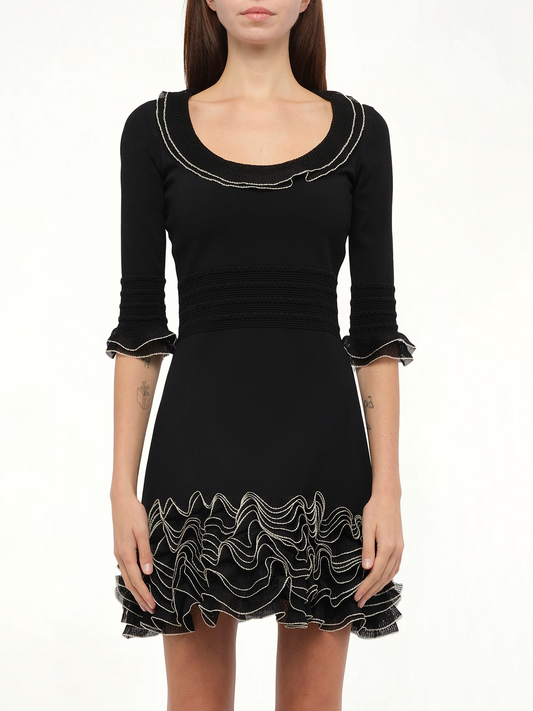 Image of a model wearing Dress. Productname: ALEXANDER MCQUEEN Amq - Plain Knit Mini Dress in 1020 colour by brand - ALEXANDER MCQUEEN