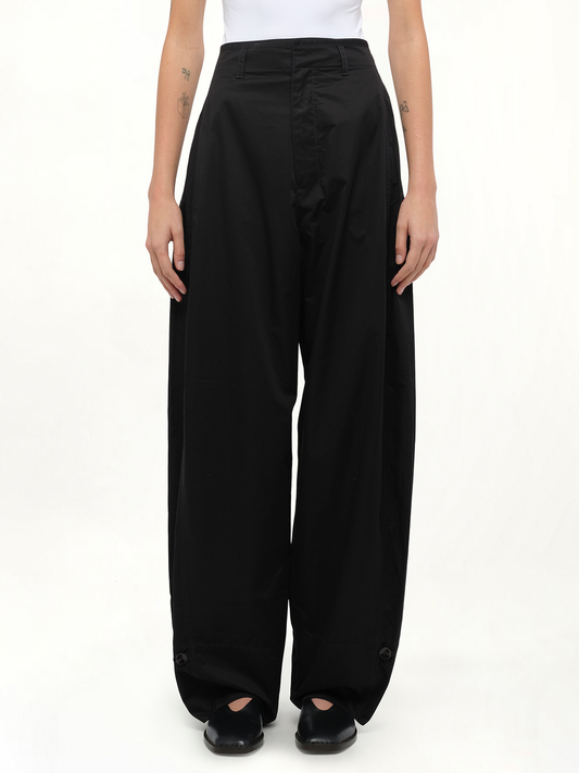 Image of a model wearing Pants. Productname: LEMAIRE Soft Volume Pants in Black colour by brand - LEMAIRE