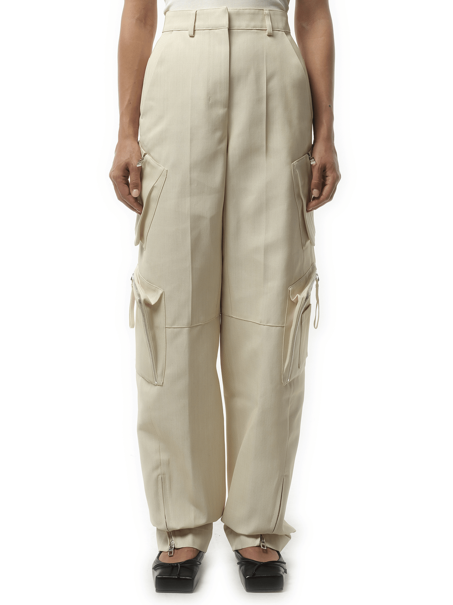 Image of a model wearing Pants. Product name - Le Cargo Atelier in Beige colour by brand - JACQUEMUS