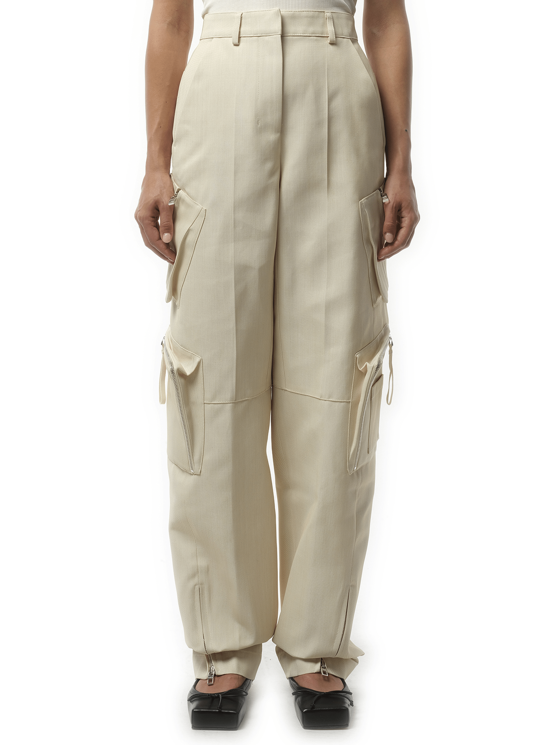 Image of a model wearing Pants. Product name - Le Cargo Atelier in Beige colour by brand - JACQUEMUS