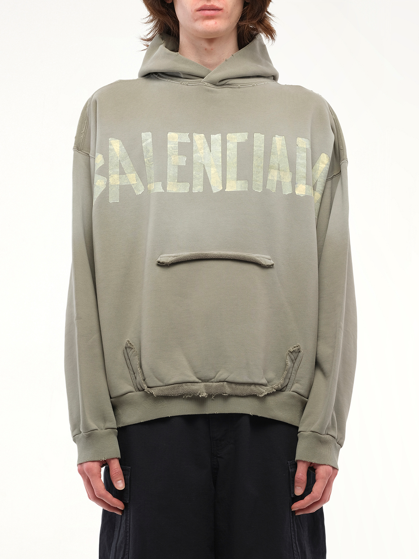 Image of a model wearing Outerwear. Productname: BALENCIAGA Tape Type Ripped Pocket Hoodie in Green colour by brand - BALENCIAGA