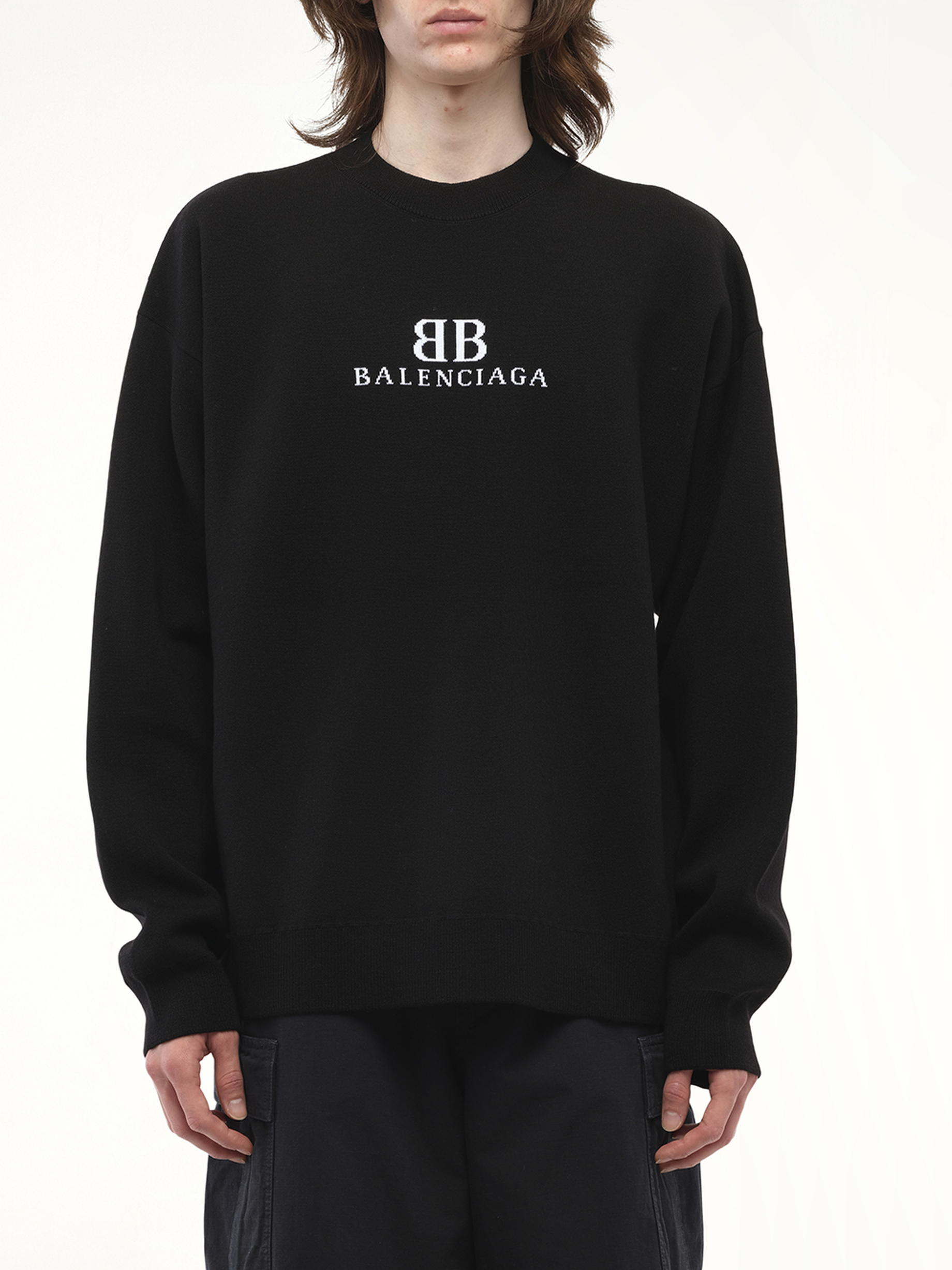 Image of a model wearing Outerwear. Productname: BALENCIAGA Crewneck Sweater in Black colour by brand - BALENCIAGA