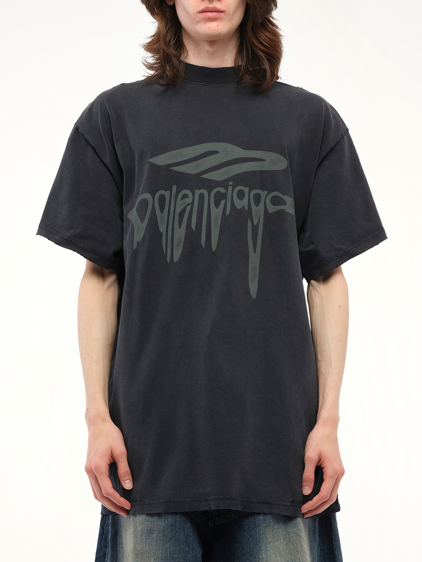 Image of a model wearing Tops. Productname: BALENCIAGA Liquified 3B Oversized T-Shirt in BLACK colour by brand - BALENCIAGA