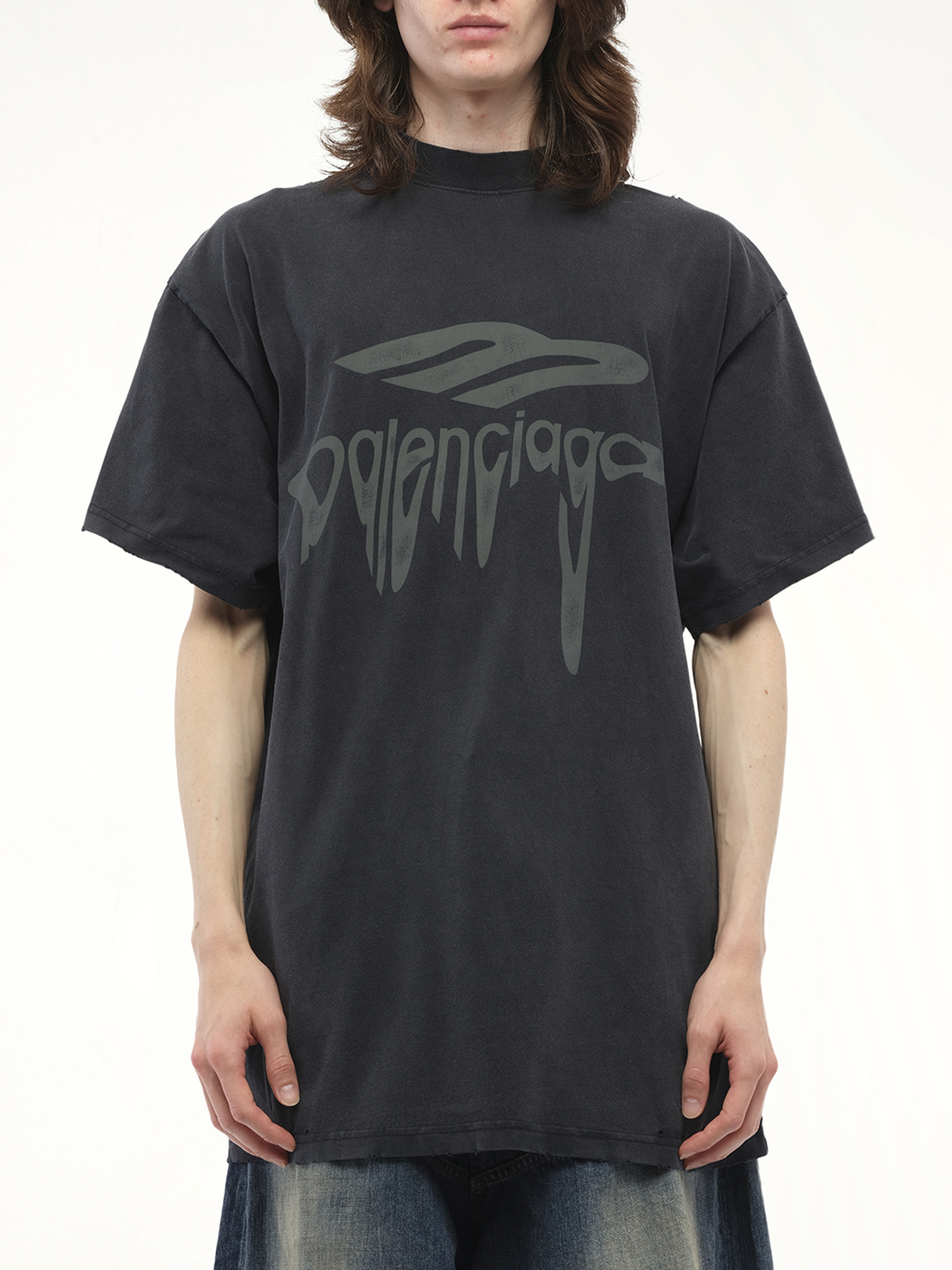 Image of a model wearing Tops. Productname: BALENCIAGA Liquified 3B Oversized T-Shirt in BLACK colour by brand - BALENCIAGA