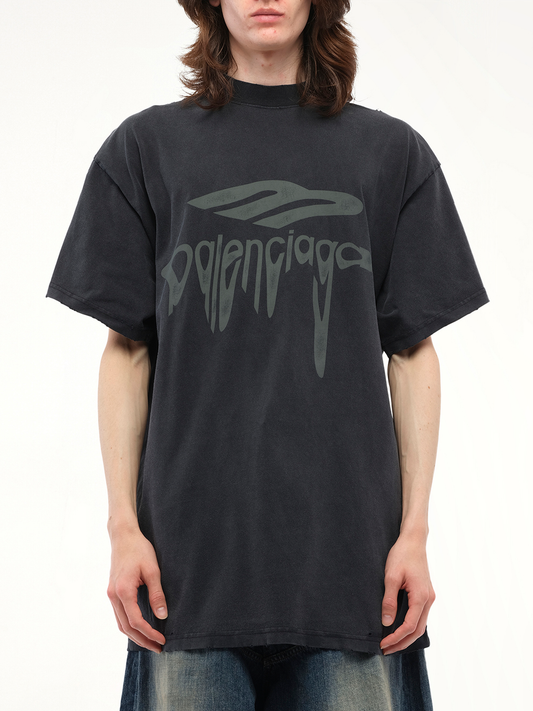 Image of a model wearing Tops. Productname: BALENCIAGA Liquified 3B Oversized T-Shirt in BLACK colour by brand - BALENCIAGA