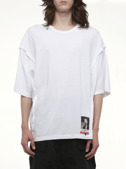 Image of a model wearing Tops. Productname: UNDERCOVER Chaos Balance T-Shirt in WHITE colour by brand - UNDERCOVER