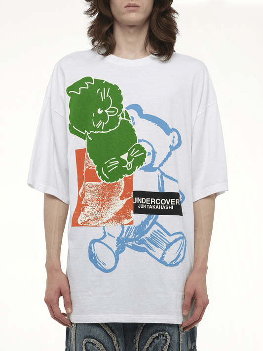 Image of a model wearing Tops. Productname: UNDERCOVER Collage Print T-Shirt in WHITE colour by brand - UNDERCOVER