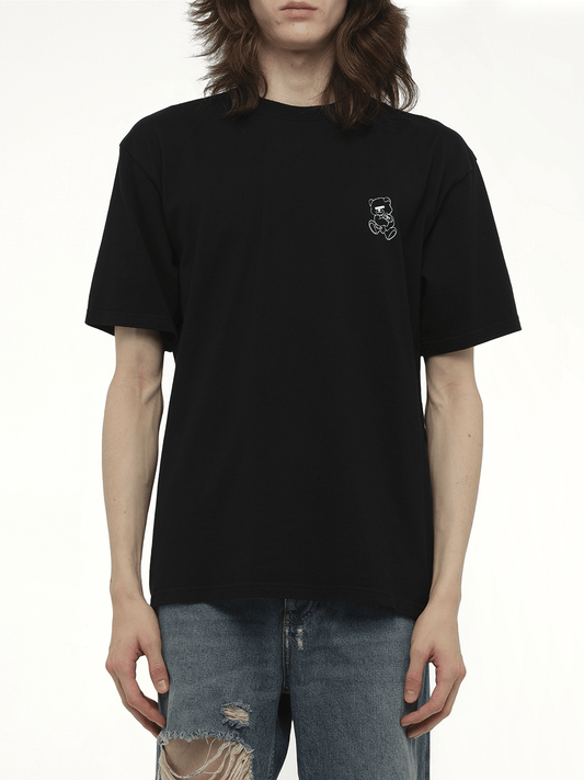 Image of a model wearing Tops. Productname: UNDERCOVER Small Teddy Bear Printed T-Shirt in BLACK colour by brand - UNDERCOVER