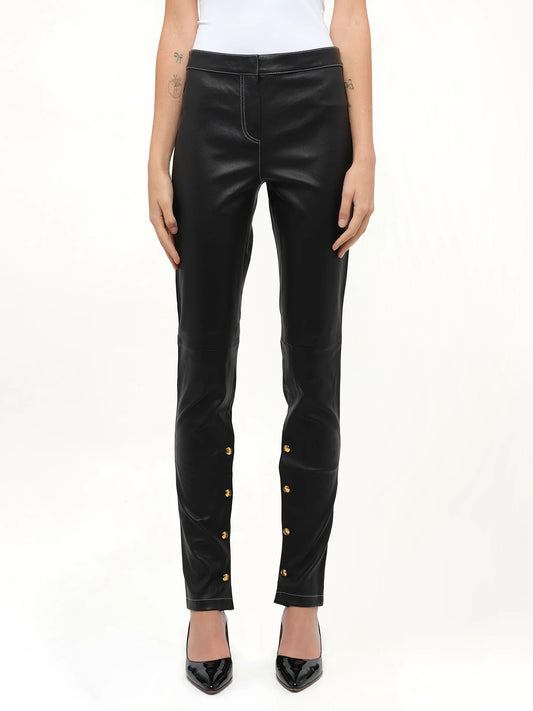 Image of a model wearing Pants. Product name - Loewe Leggings in Black colour by brand - LOEWE