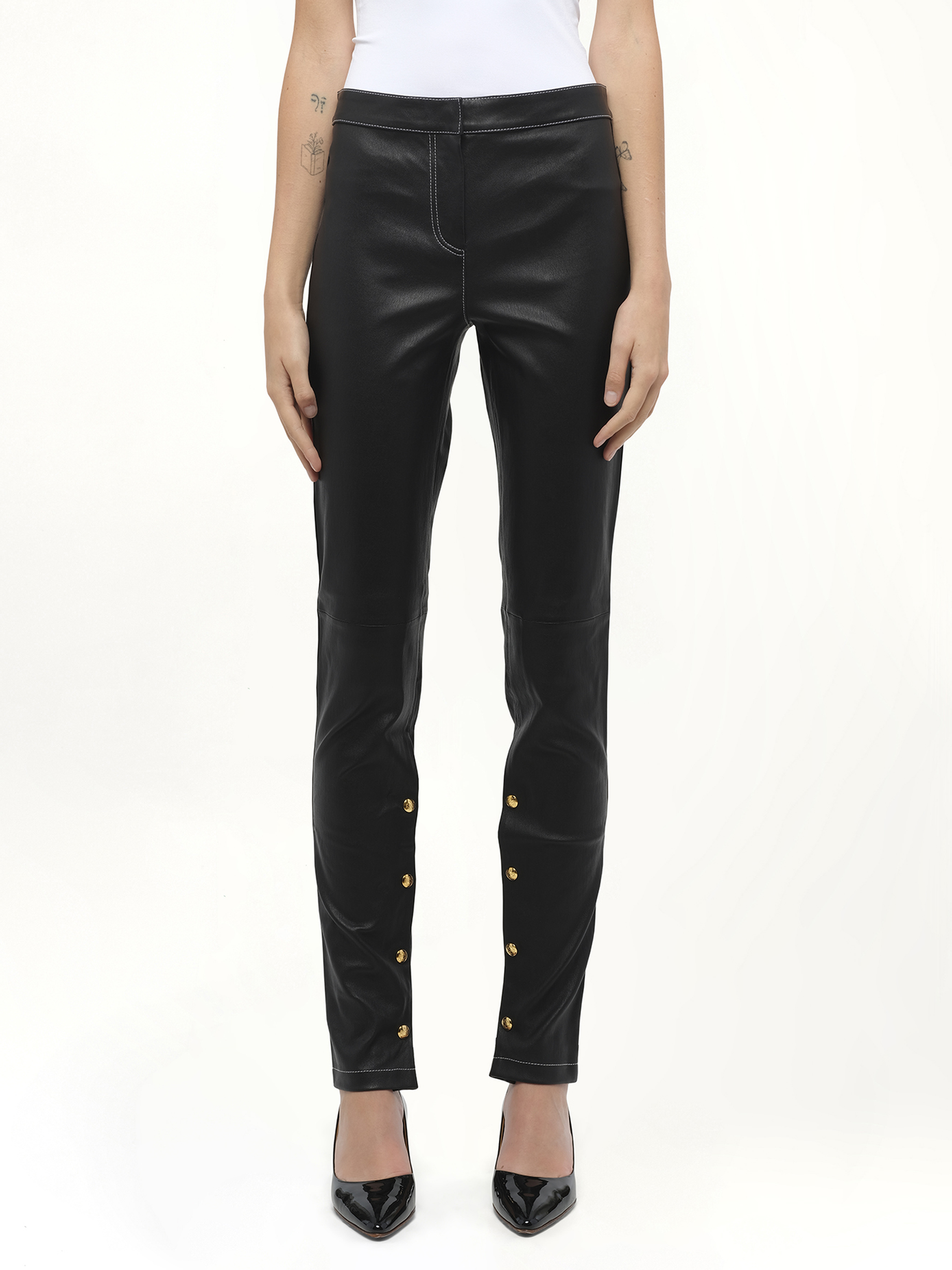 Image of a model wearing Pants. Product name - Loewe Leggings in Black colour by brand - LOEWE
