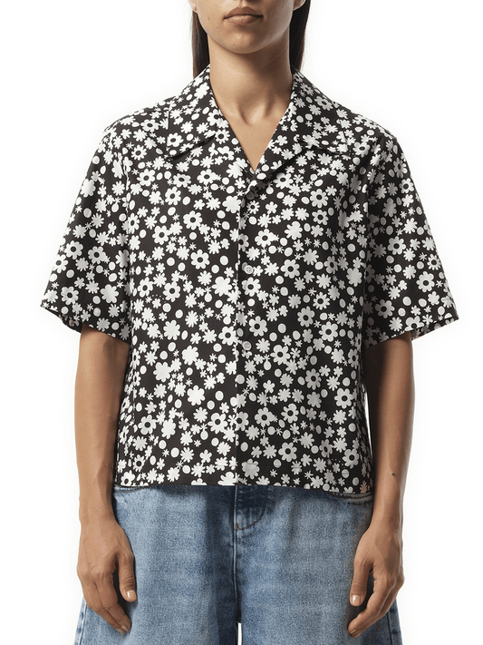 Image of a model wearing Shorts. Productname: MARNI Flower Print Short Sleeve Shirt in Black colour by brand - MARNI