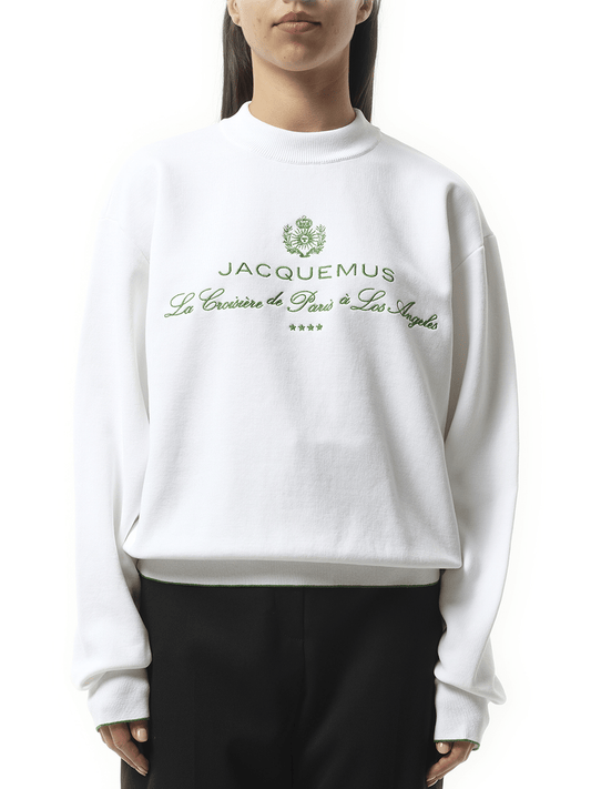 Image of a model wearing Outerwear. Productname: JACQUEMUS La Maille Venice Hotel in WHITE colour by brand - JACQUEMUS