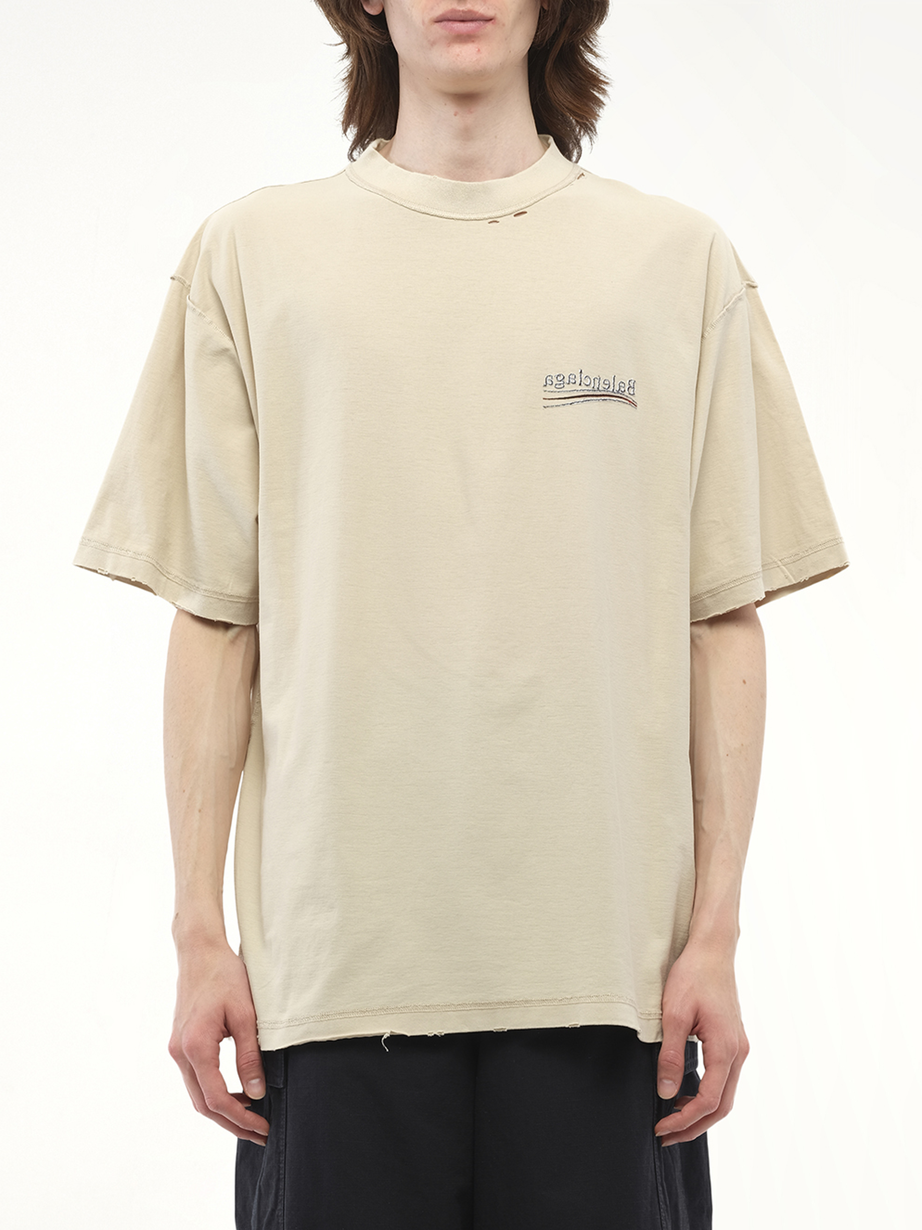 Image of a model wearing Tops. Productname: BALENCIAGA Political Inside-Out Large T-Shirt in Beige colour by brand - BALENCIAGA