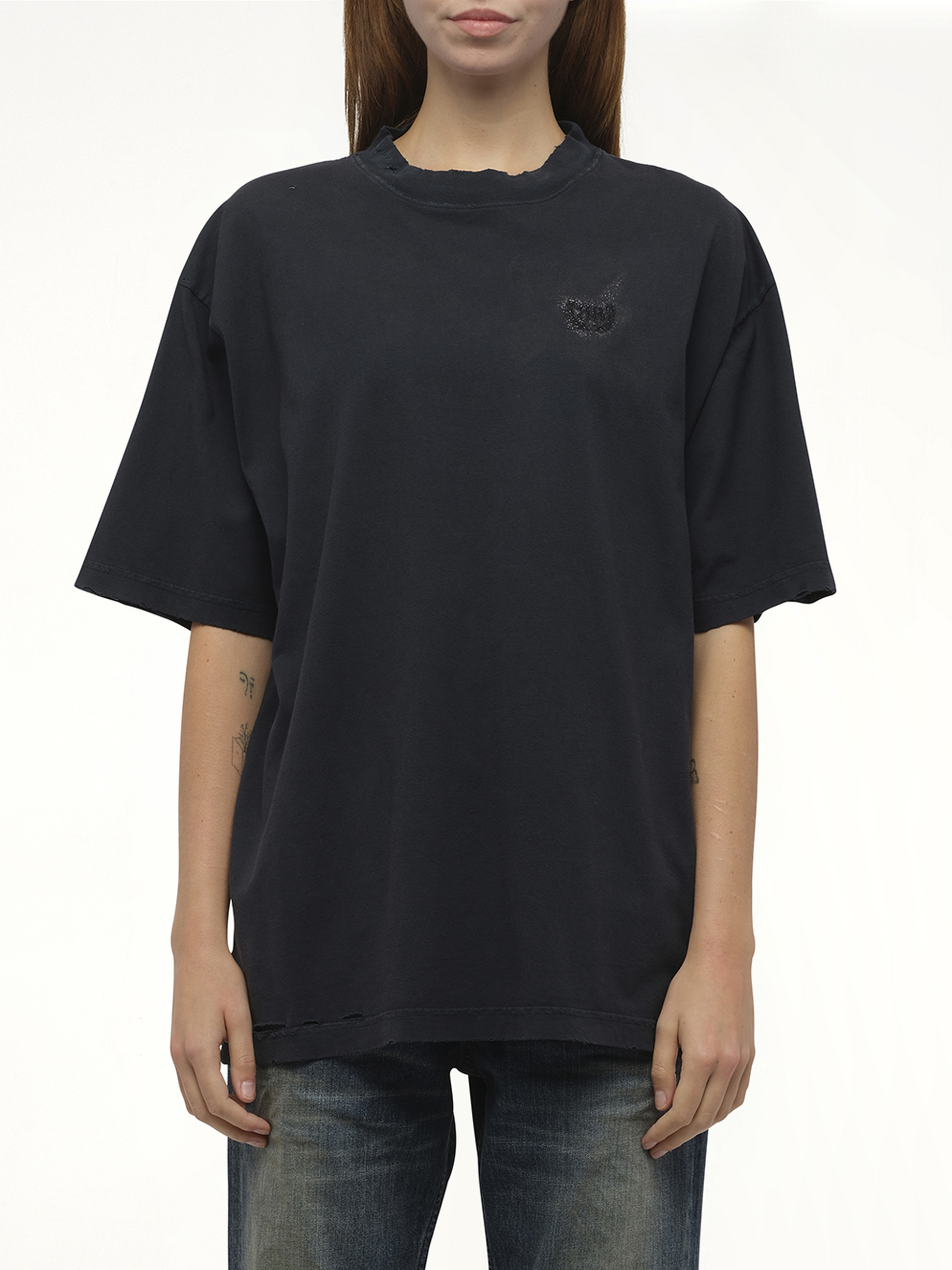 Image of a model wearing Tops. Productname: BALENCIAGA Nail Polish Medium Fit T-Shirt in Black colour by brand - BALENCIAGA