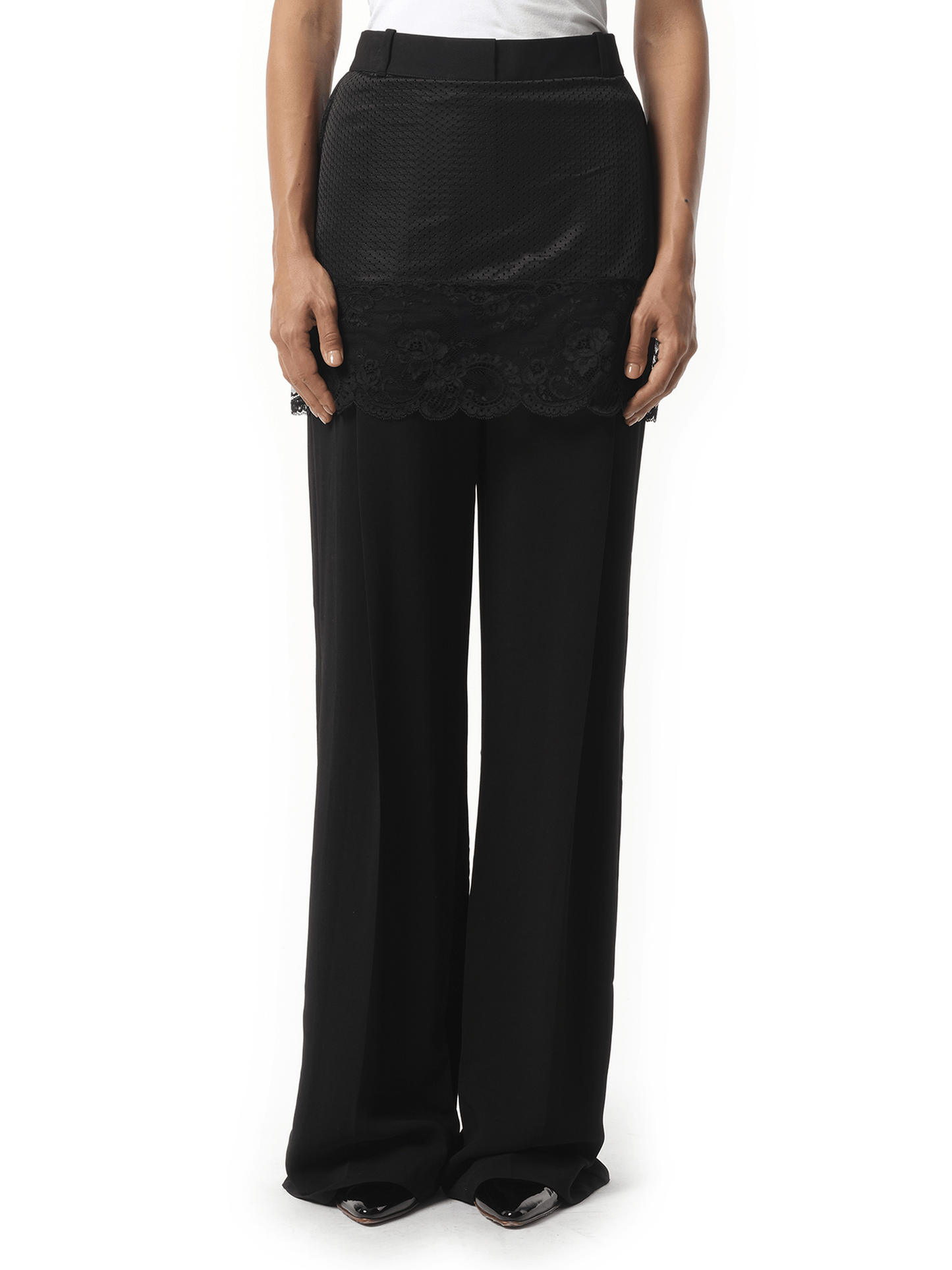 Image of a model wearing Pants. Product name - Givenchy Trousers in Black colour by brand - GIVENCHY