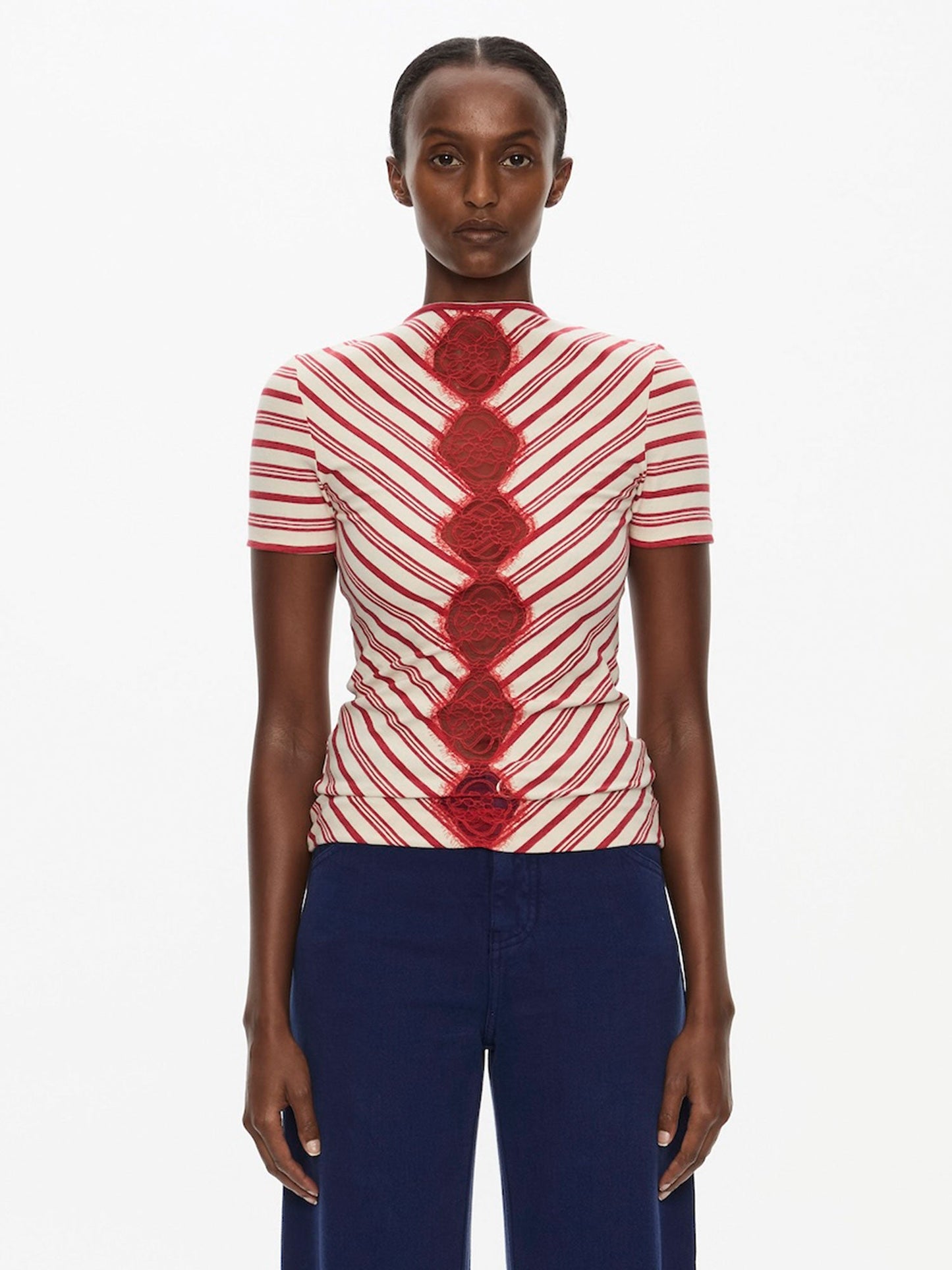 Image of a model wearing Tops. Product name - Mavis V-Neck Tee in Tee colour by brand - Christopher Esber