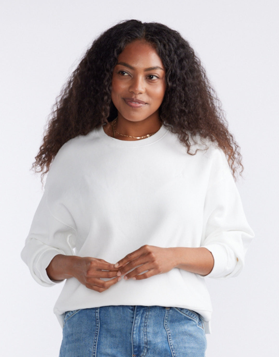 Image of a model wearing Tops. Productname: The Monogram Lounger Fleece Crew - in White colour by brand - White & Co.