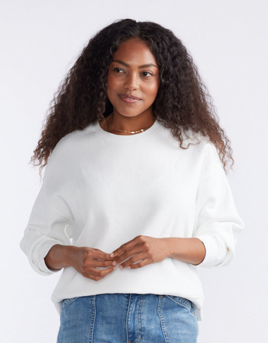 Image of a model wearing Tops. Productname: The Monogram Lounger Fleece Crew - in White colour by brand - White & Co.