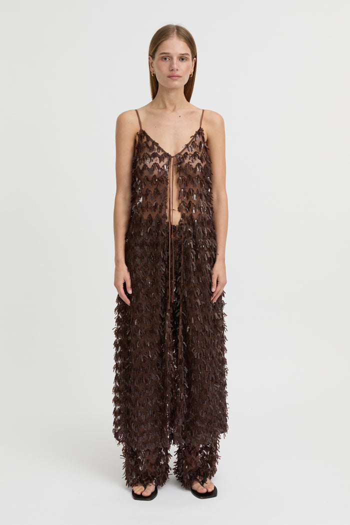 Image of a model wearing Pants. Product name - Ro Pants Brown in Brown colour by brand - Blanca Studio
