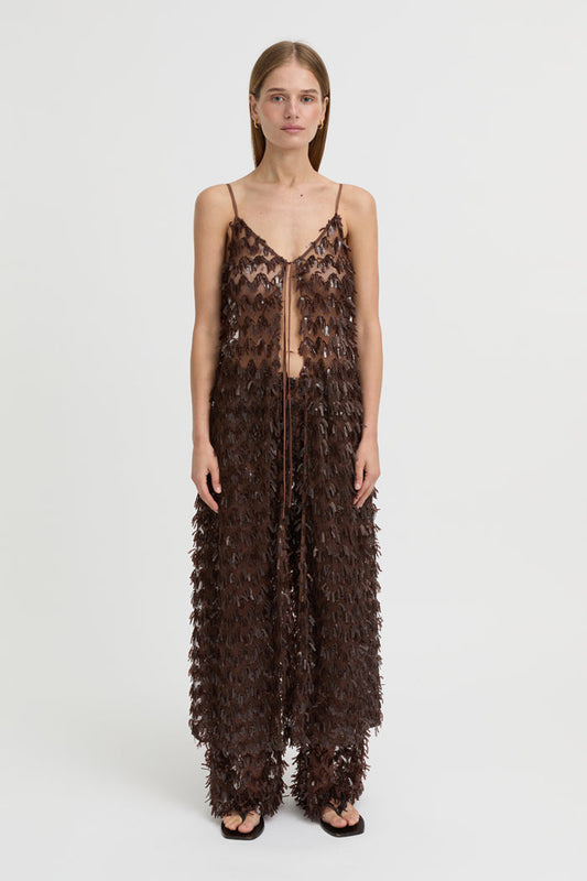 Image of a model wearing Pants. Product name - Ro Pants Brown in Brown colour by brand - Blanca Studio