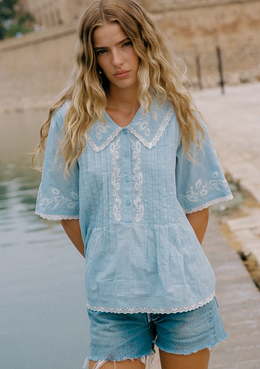 Image of a model wearing Tops. Productname: Auguste The Label Lennon Blouse in Blue colour by brand - Auguste The Label