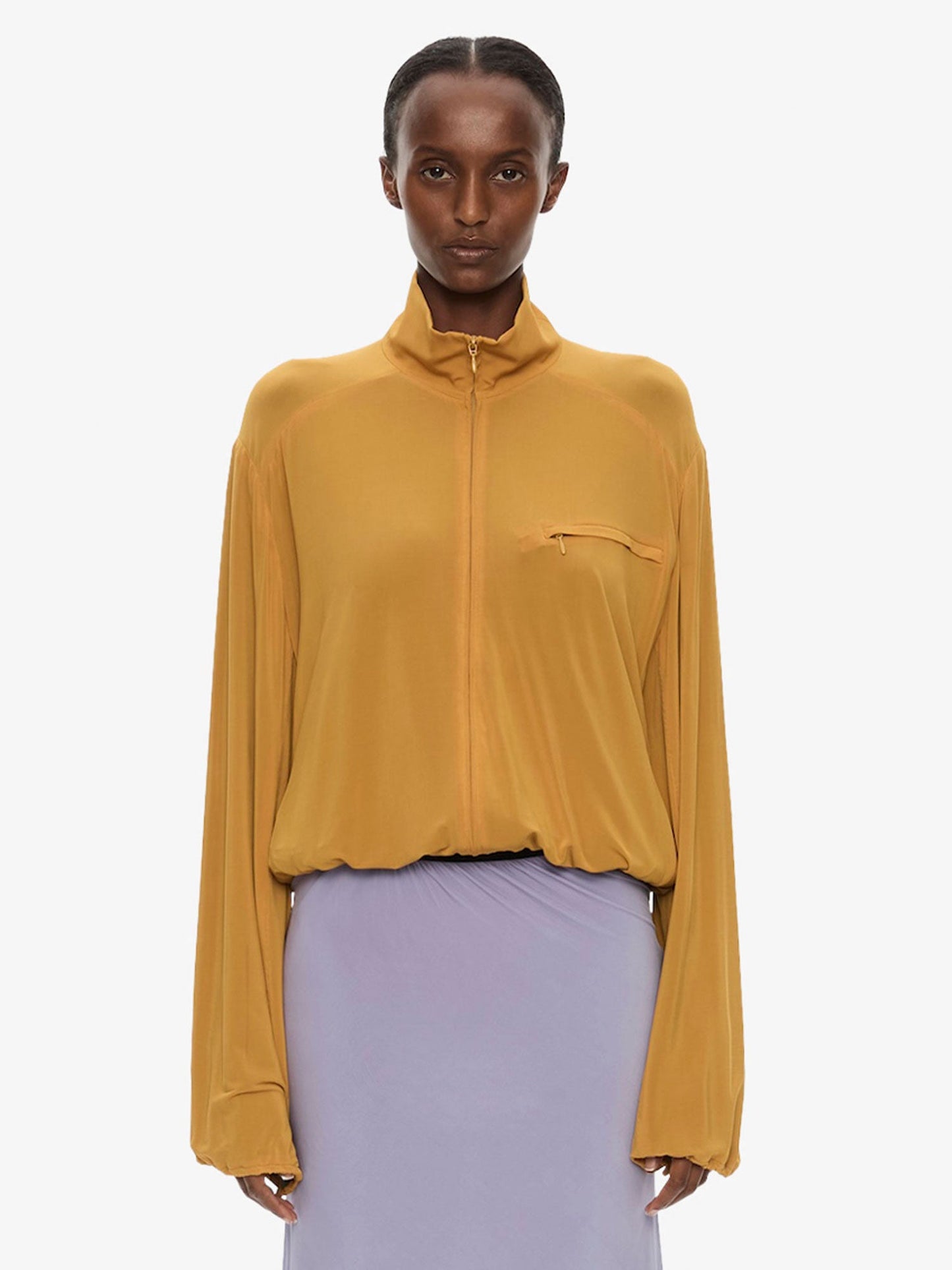 Image of a model wearing Outerwear. Product name - Dannie Jersey Jacket in Caper colour by brand - CHRISTOPHER ESBER