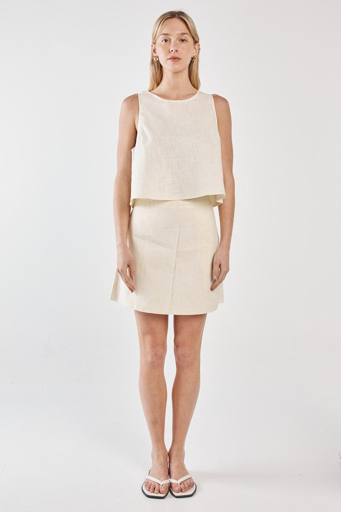 Image of a model wearing Skirts. Product name - Vienne Skirt Butter Yellow in Butter Yellow colour by brand - Sass Clothing
