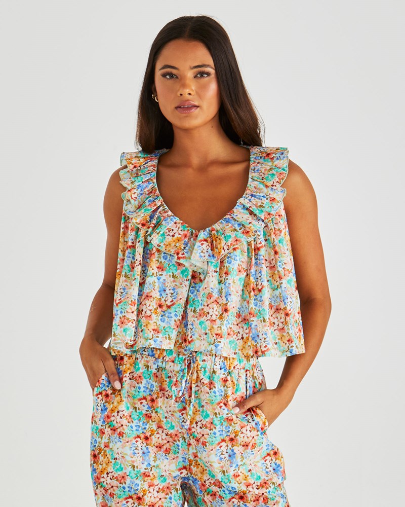 Image of a model wearing Tops. Product name - Panna Ruffled Neck Tank Blossom in Blossom colour by brand - Sass Clothing