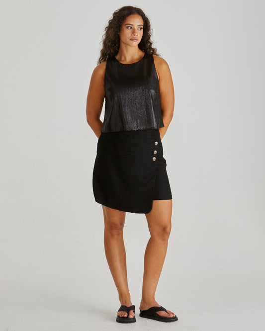 Image of a model wearing Skirts. Product name - Coast Mini Wrap Skirt Black in Black colour by brand - Sass Clothing