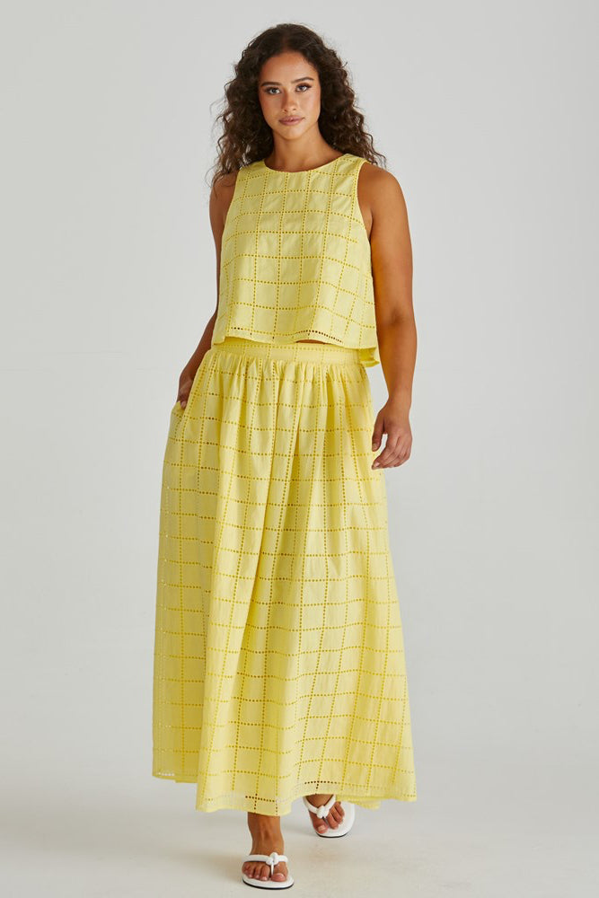 Image of a model wearing Skirts. Product name - Helmi Broderie Full Skirt Yellow in Yellow colour by brand - Sass Clothing