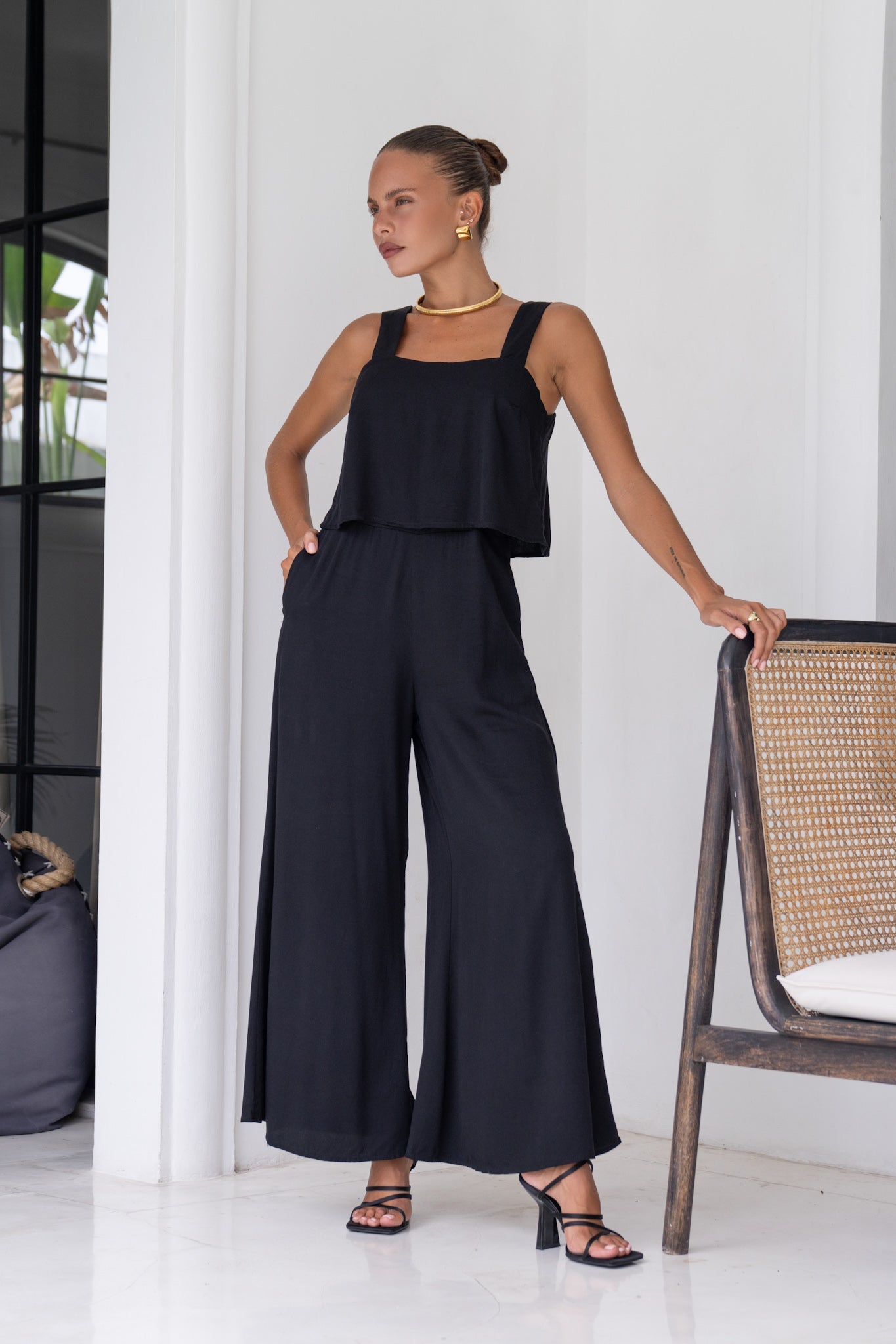 Image of a model wearing Outerwear. Productname: Heychic Adele Black Jumpsuit in Black colour by brand - Heychic