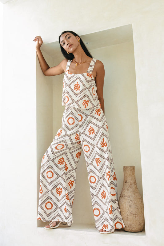 Image of a model wearing Outerwear. Productname: Heychic Savita Rust Tropical Jumpsuit in Beige colour by brand - Heychic