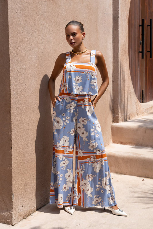 Image of a model wearing Outerwear. Productname: Heychic Meadow Floral Jumpsuit in Blue colour by brand - Heychic